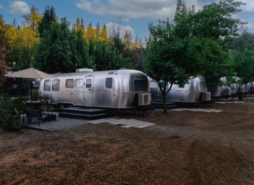 Row of Airstream RVs at a campsite