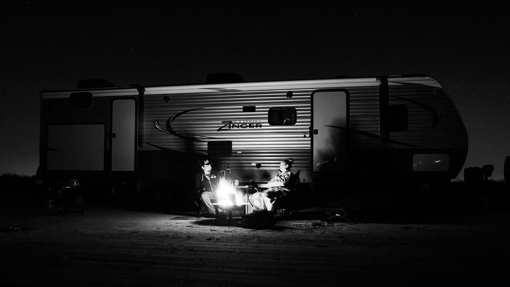 A campfire at night roasting smores