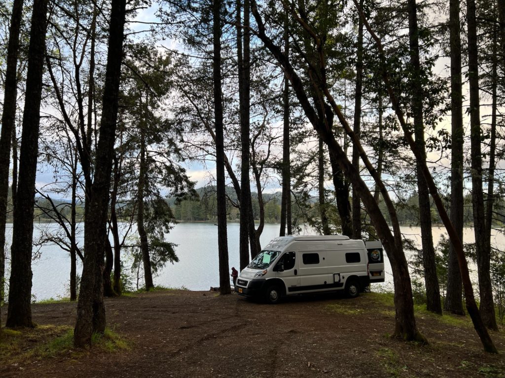 RV in a lake front forest